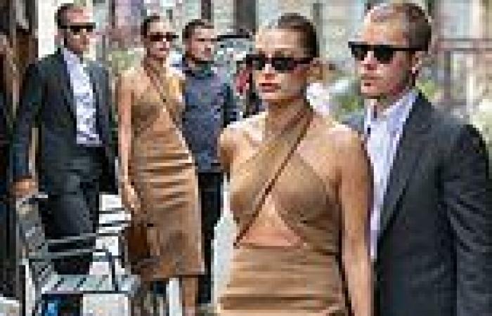 Hailey Bieber flaunts midriff in a  wraparound dress as she steps out with ...