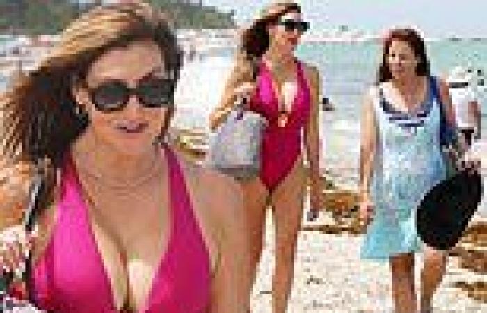 Heather McDonald takes the plunge in VERY low-cut fuchsia bathing suit
