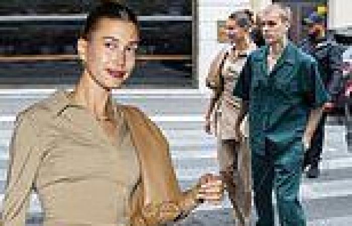 Justin Bieber and wife Hailey both wear khaki as they walk hand-in-hand on ...