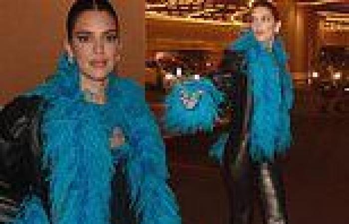 Kendall Jenner rocks a blue feather boa as she hits the Las Vegas Strip after ...