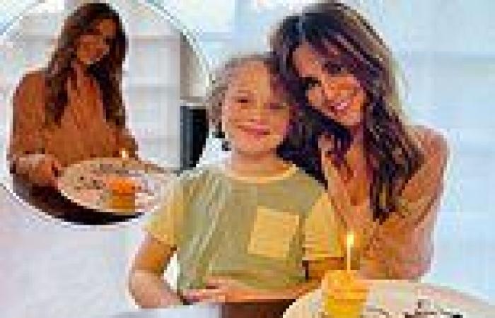 Cheryl poses for a snap with Kimberley Walsh's son Bobby while celebrating her ...
