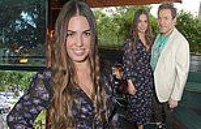 Amber Le Bon, 31, looks chic in a floral dress as she joins her father Simon, ...