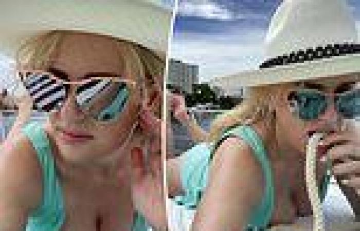 Rebel Wilson shows off her cleavage in a plunging swimsuit after losing 30kg