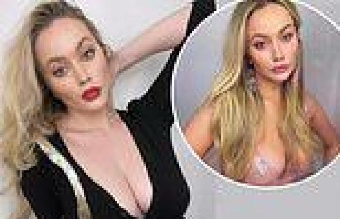 Simone Holtznagel showcases her cleavage in a tight black blouse