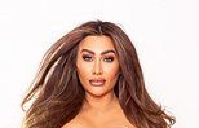 Pregnant Lauren Goodger covers her ample chest as she shows off her burgeoning ...