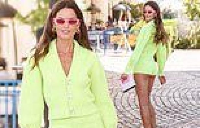 Izabel Goulart leaves little to the imagination in vivid green hot pants at ...