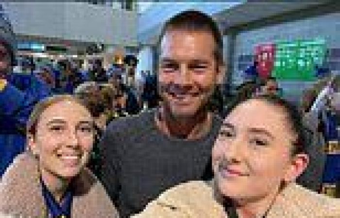Reformed AFL star Ben Cousins poses with fans as long-time agent Ricky Nixon ...
