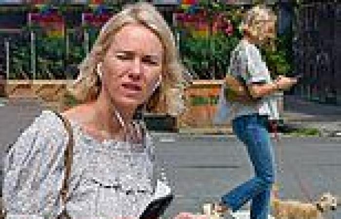 Naomi Watts cuts a stylish figure as she catches up on texts while taking her ...
