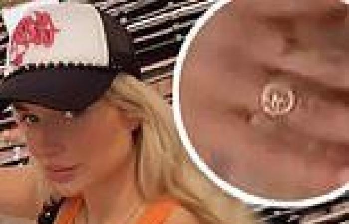 Lottie Moss flashes a gold ring on her engagement finger three months after her ...