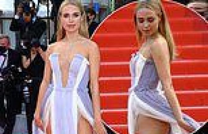 Kimberley Garner flashes her pert posterior in a thigh-split gown at the France ...
