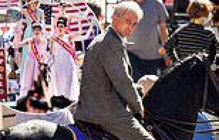 Harrison Ford's body double rides a horse while filming parade scenes for ...