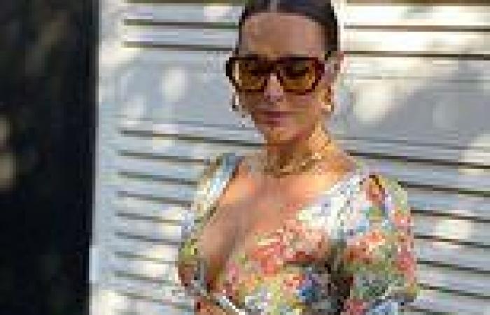 WAG Clementine McVeigh shows off her cleavage and toned tummy in a floral ...