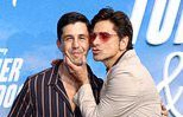 John Stamos puckers up to close friend Josh Peck at the Turner & Hooch premiere ...