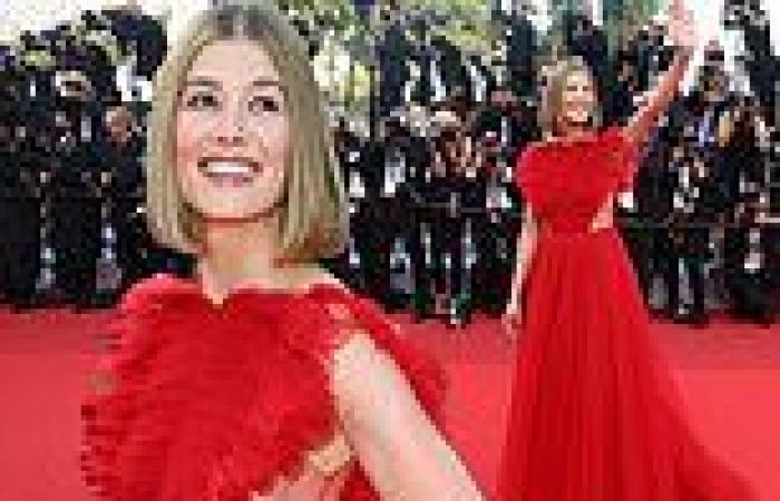 Rosamund Pike flashes a hint of side boob in a scarlet tulle gown at Cannes ...