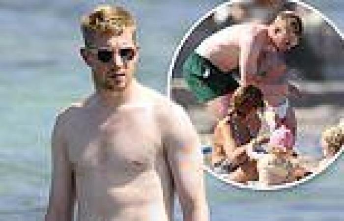 Footballer Kevin De Bruyne goes shirtless during a day on a beach with his ...
