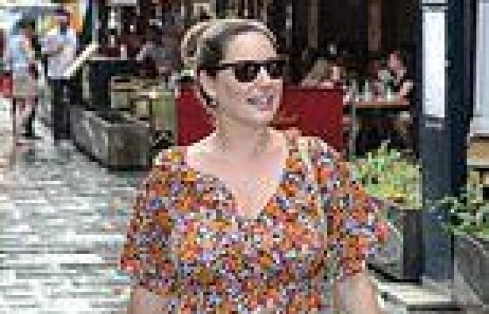 Kelly Brook looks chic in floaty floral dress and tan sandals