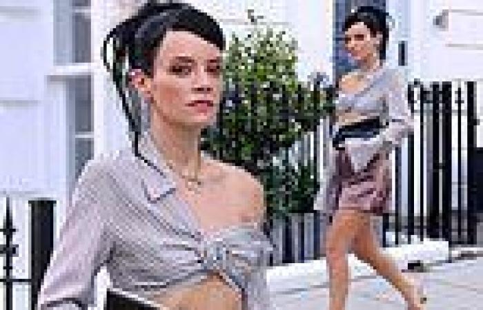 Lily Allen wears mini shorts and quirky asymmetric shirt as she poses for her ...