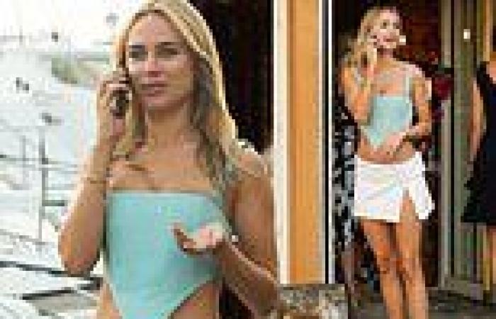 Kimberley Garner flashes glimpse of washboard abs in corseted crop top and ...