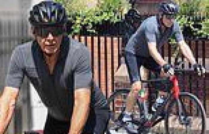 Harrison Ford shows off his toned physique as he cycles through the streets of ...