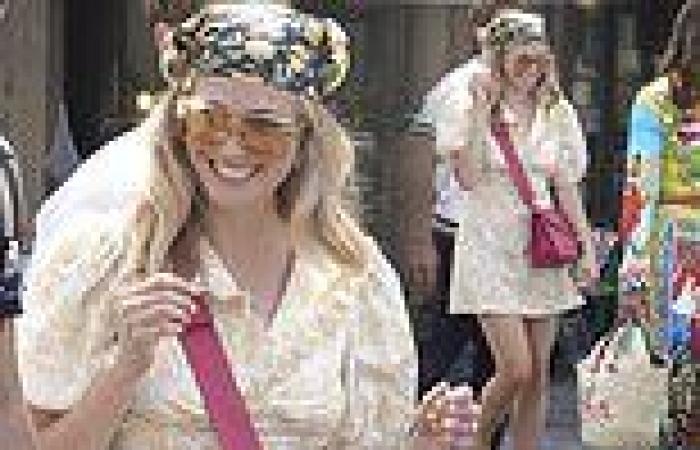 Pixie Lott cuts a chic figure in a floral yellow dress and patterned headscarf ...