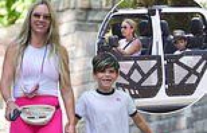 Teddi Mellencamp looks fit in neon pink shorts as she hikes with her son Cruz ...