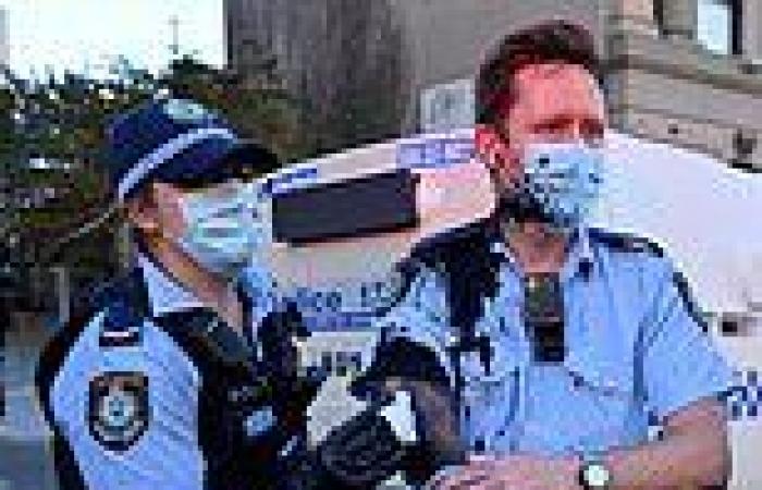 Coronavirus Australia: Officer splattered with ink by protestors later shakes ...