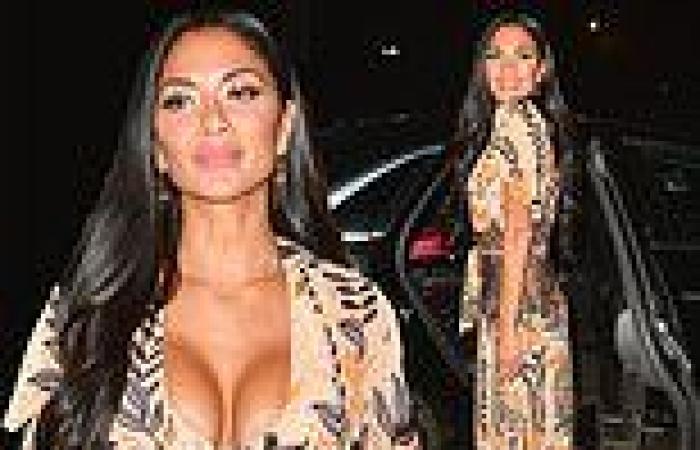 Nicole Scherzinger shows off her summer glow in a low-cut dress while back in ...