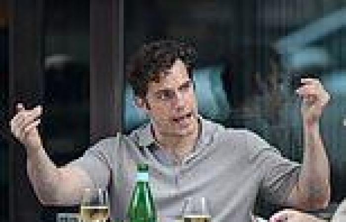 Henry Cavill puts on an animated display while enjoying al-fresco lunch with a ...