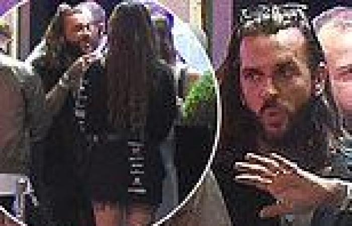 TOWIE star Pete Wicks chats to a mystery brunette as he queues to visit STRIP ...