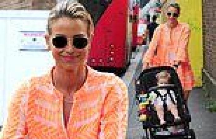Vogue Williams stands out from the crowd in flowing orange dress as she heads ...