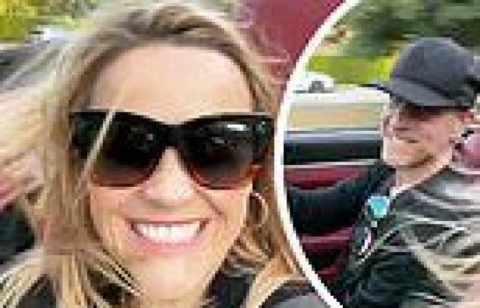 Reese Witherspoon and her husband Jim Toth cruise in a convertible on his ...