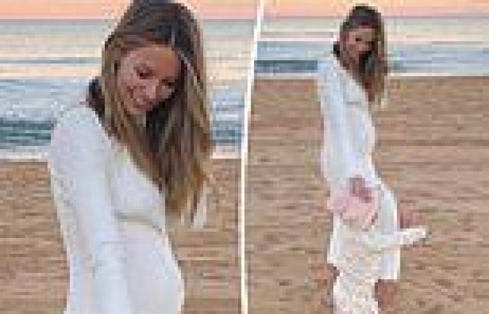 Jennifer Hawkins shows off her growing baby bump after announcing her second ...