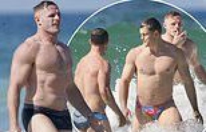 Tom Burgess strips down to his undies and hits the surf with his Rabbitohs ...
