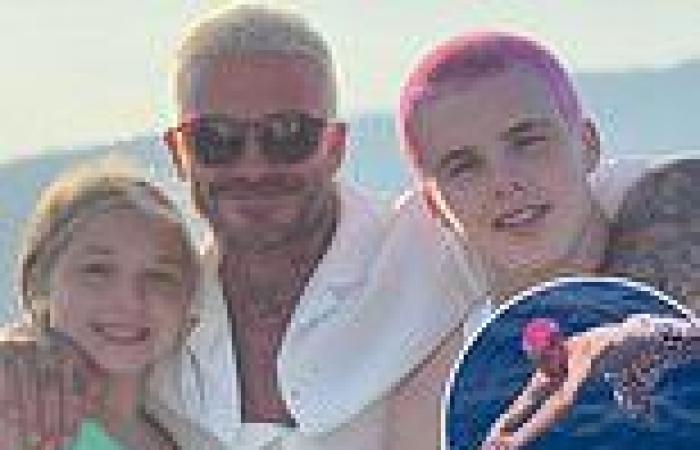 David Beckham poses in sweet holiday snaps with children Harper, 10, and Cruz, ...