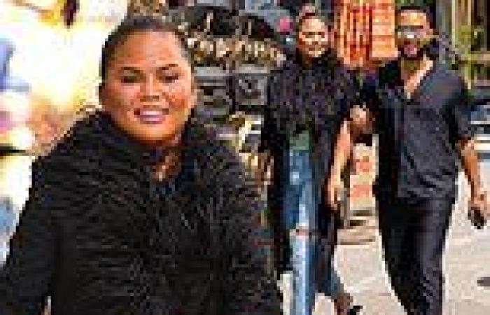 Chrissy Teigen is all smiles in feathered jacket with ripped jeans while ...