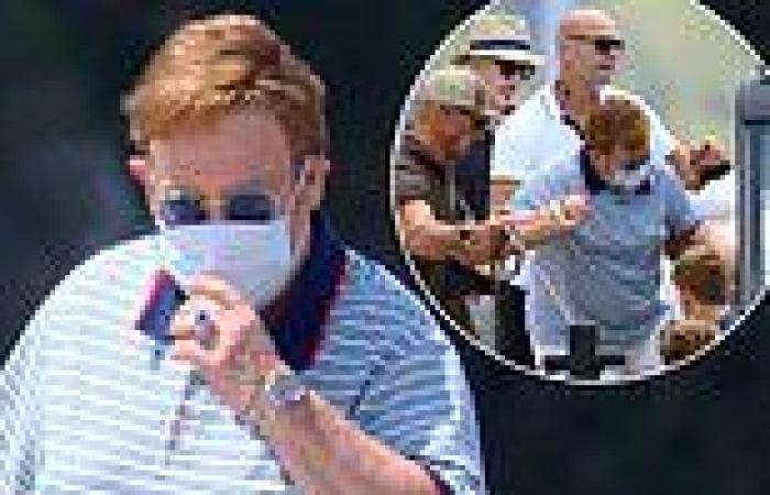 Sir Elton John dresses up in Gucci for lunch in Cannes with husband David ...