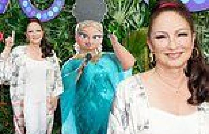 Gloria Estefan strikes a pose with her animated character Marta at Vivo ...