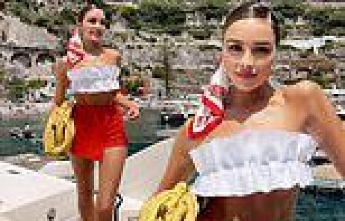 Olivia Culpo shows off her Mediterranean tan in white bandeau top and red shorts