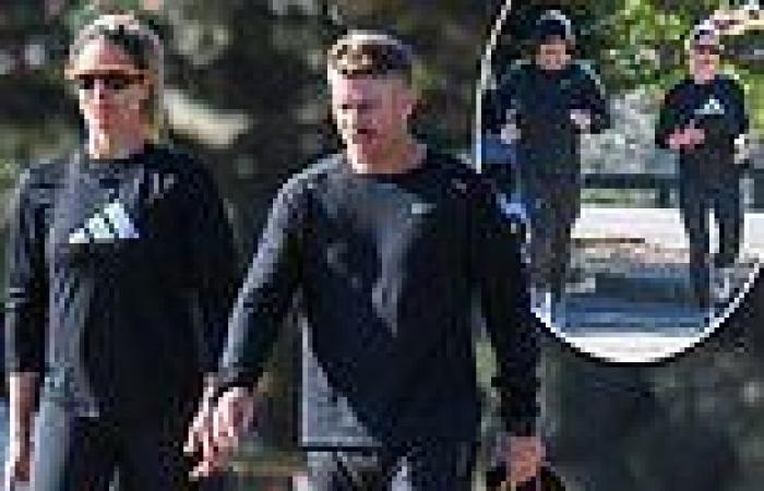 Candice Warner and husband David wear similar outfits as they go for a jog ...