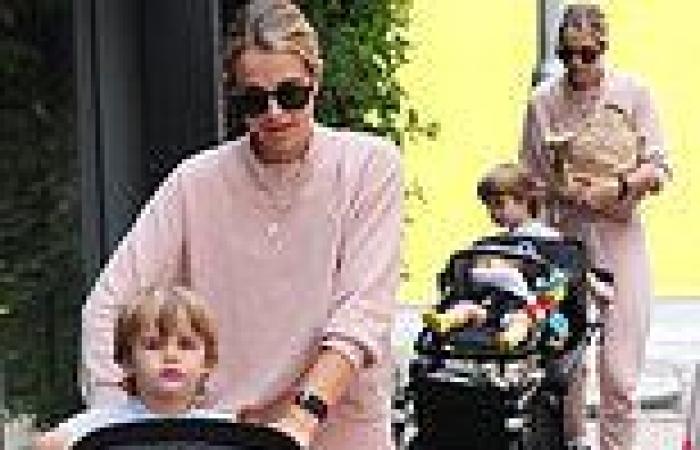 Vogue Williams cuts a casual figure as she steps out for a walk with Theodore, ...