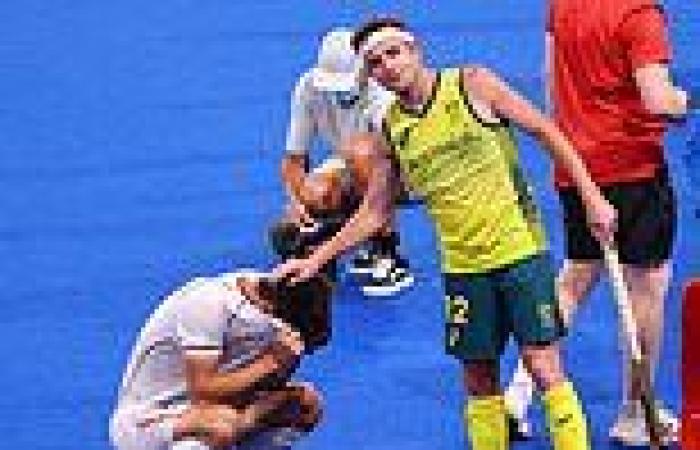 Australia's victorious hockey team console Germany after defeating them in ...