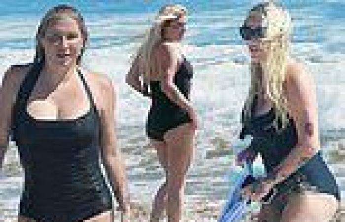 Kesha looks happy and healthy as she enjoys a beach day with friends