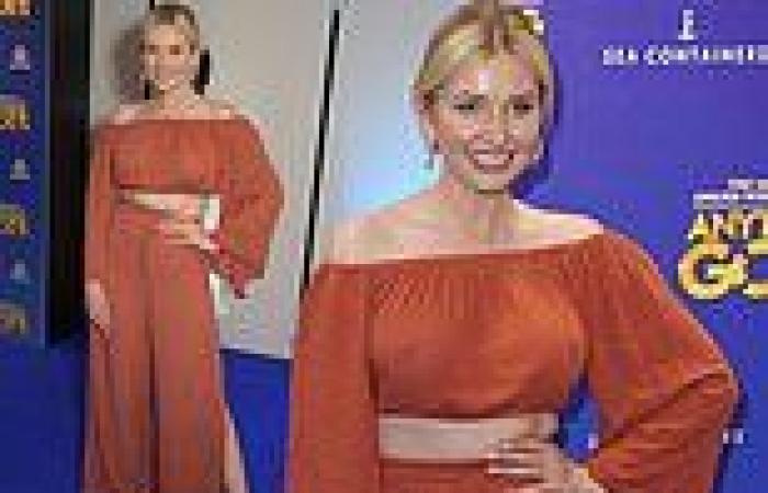 Amy Hart looks a vision in a spice-coloured ensemble for a performance of ...
