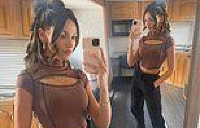 Michelle Keegan puts her slim waist on display in a brown cut-out crop top and ...