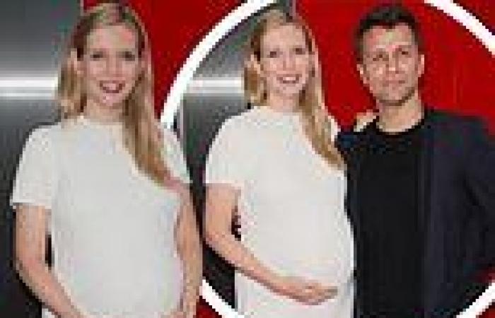 Rachel Riley cradles her baby bump as she arrives for Singing In The Rain press ...