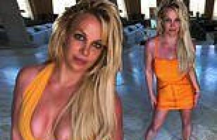 Britney Spears models sexy orange dresses in living room: 'I just wanted to ...
