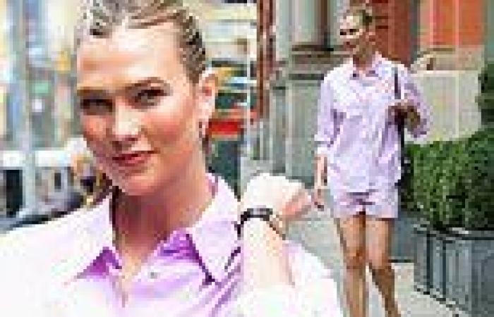 Karlie Kloss is all smiles as she struts around NYC in a lavender dress shirt ...
