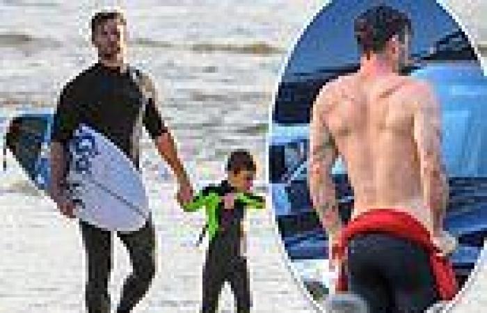 Chris Hemsworth flaunts his muscles during homeschool surf session in Byron Bay
