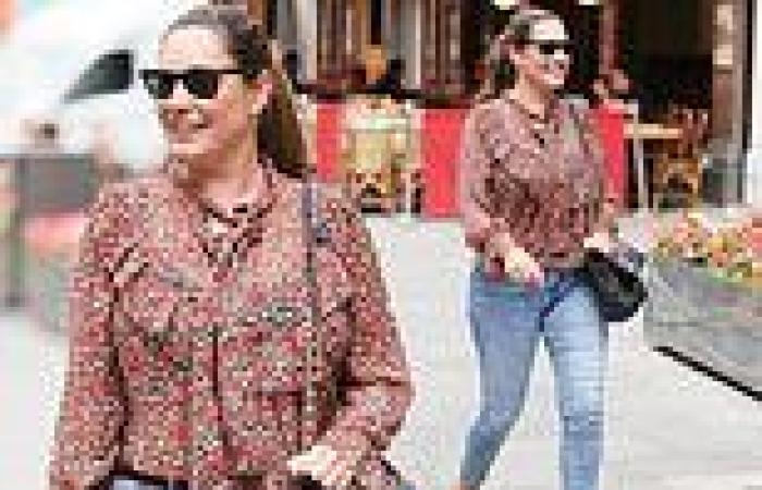 Kelly Brook looks radiant in a floaty floral top and jeans for Heart FM show at ...