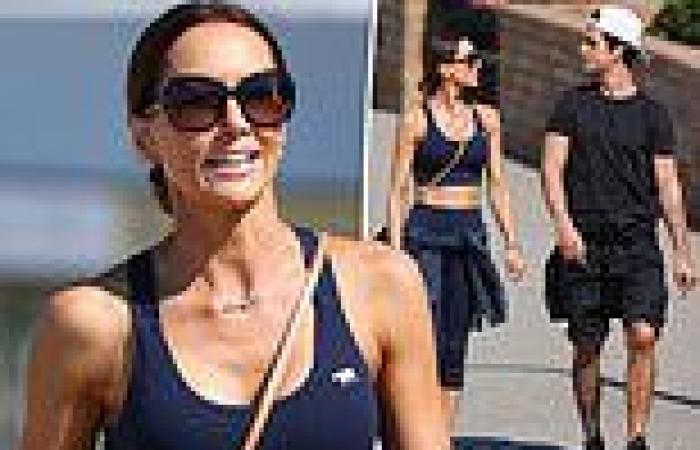 Kyly Clarke strolls with her hunky fitness coach in Bondi